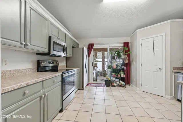 a kitchen with stainless steel appliances granite countertop a sink and cabinets