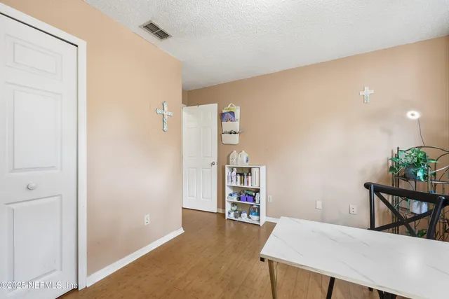 a view of a livingroom with furniture and cabinet