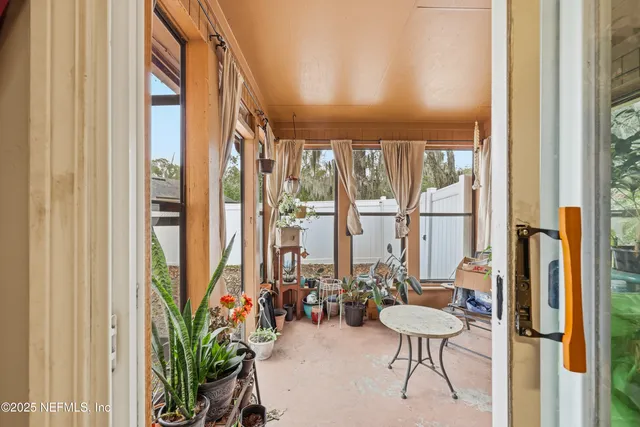 a view of a balcony with chairs