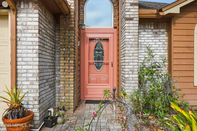 a front view of a house with a many windows