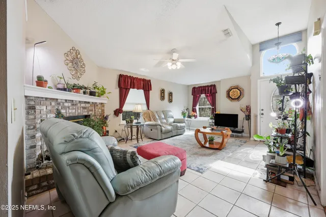 a living room with furniture and a fireplace