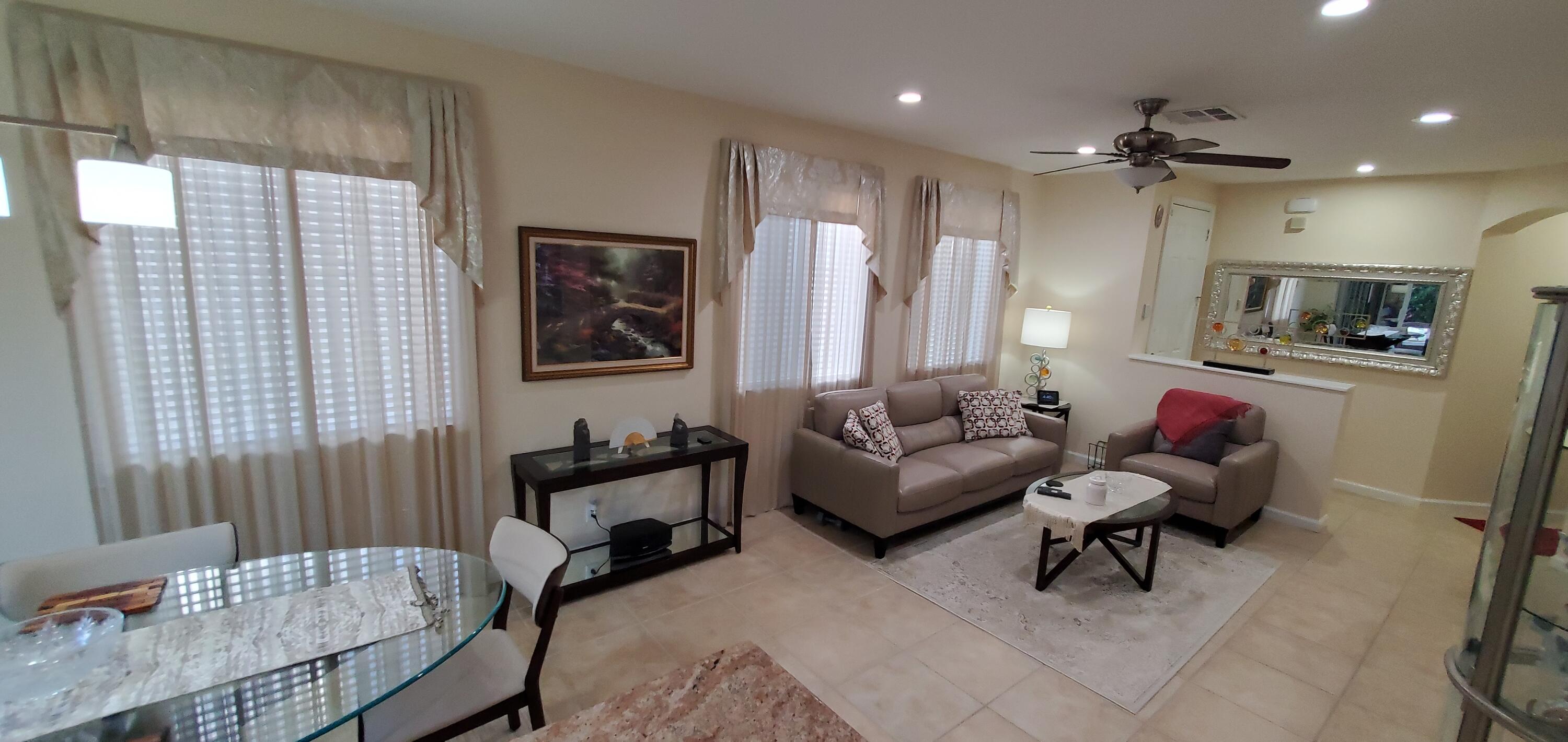 3195 Laurel Ridge Circle Riviera Beach, FL 33404 - Photo 13 of 52 living and dining room