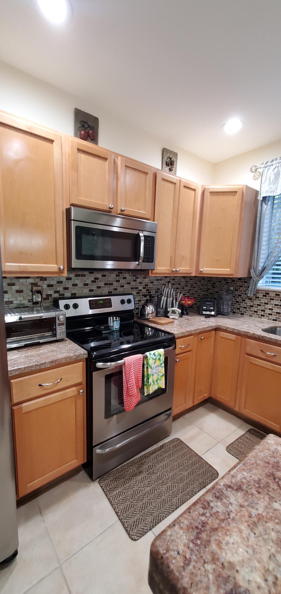 3195 Laurel Ridge Circle Riviera Beach, FL 33404 - Photo 25 of 52 Plenty of Cabinets