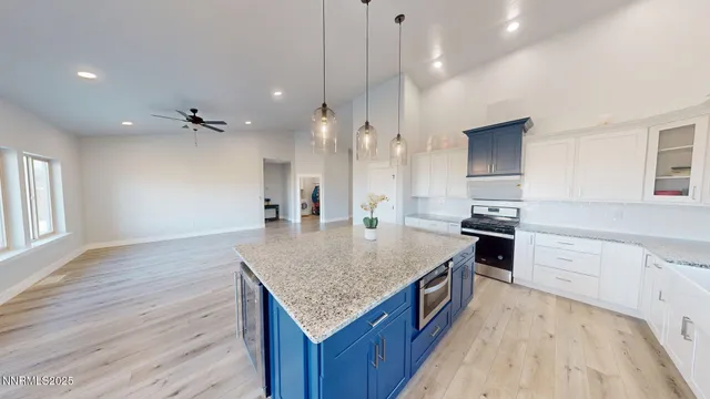 a view of a living room and kitchen with hardwood floor