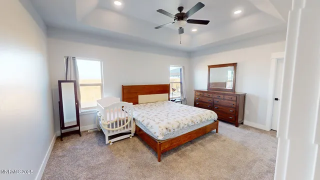 a bathroom with a granite countertop sink a mirror and shower