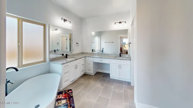 a bathroom with a tub and a shower
