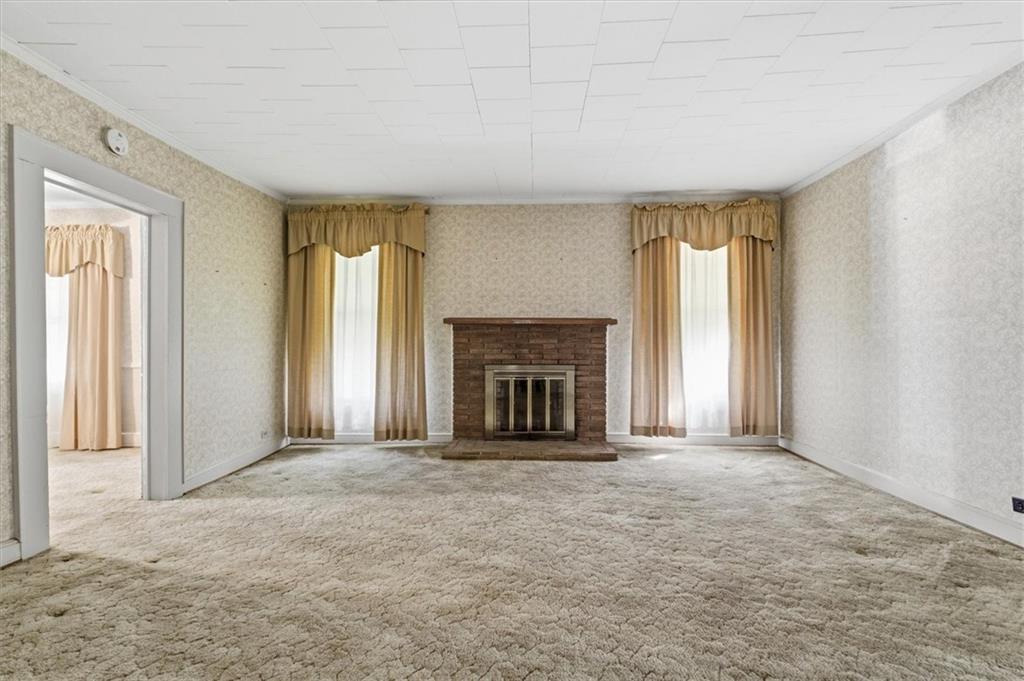 870 Marietta Road Canton, GA 30114 - Photo 11 of 43 an empty room with windows and a fireplace