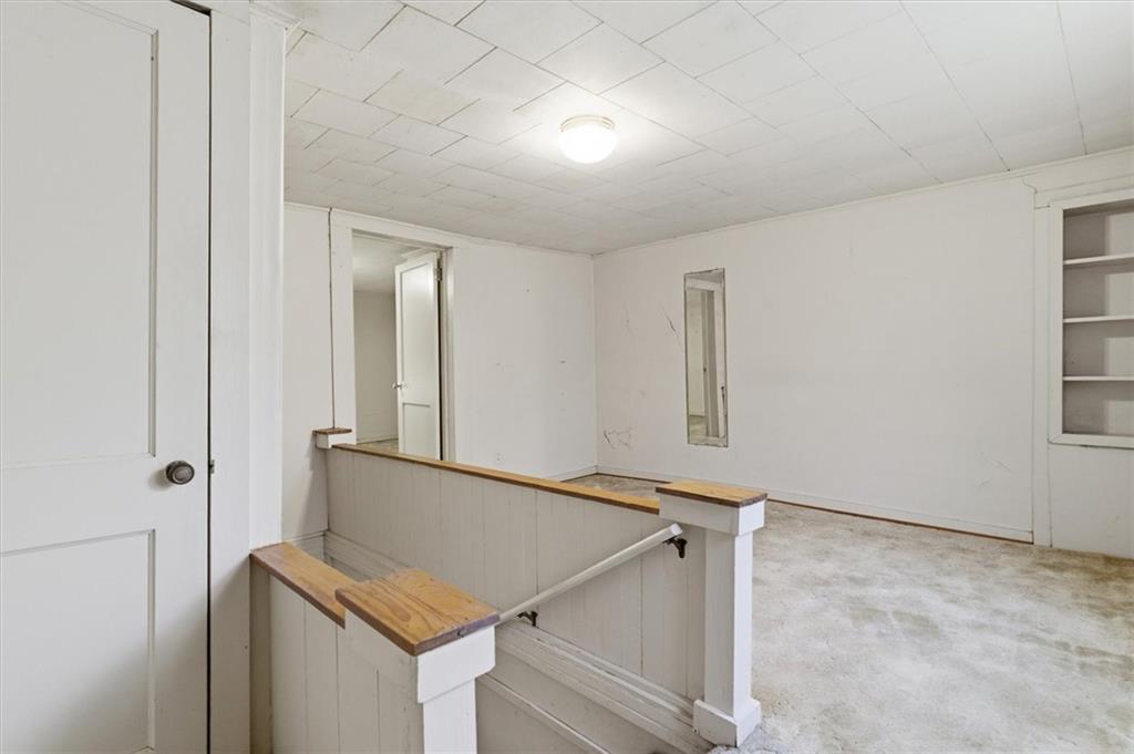870 Marietta Road Canton, GA 30114 - Photo 19 of 43 a view of room with window and hallway