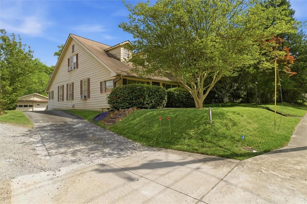 870 Marietta Road Canton, GA 30114 - Photo 2 of 43 a view of a house with a yard
