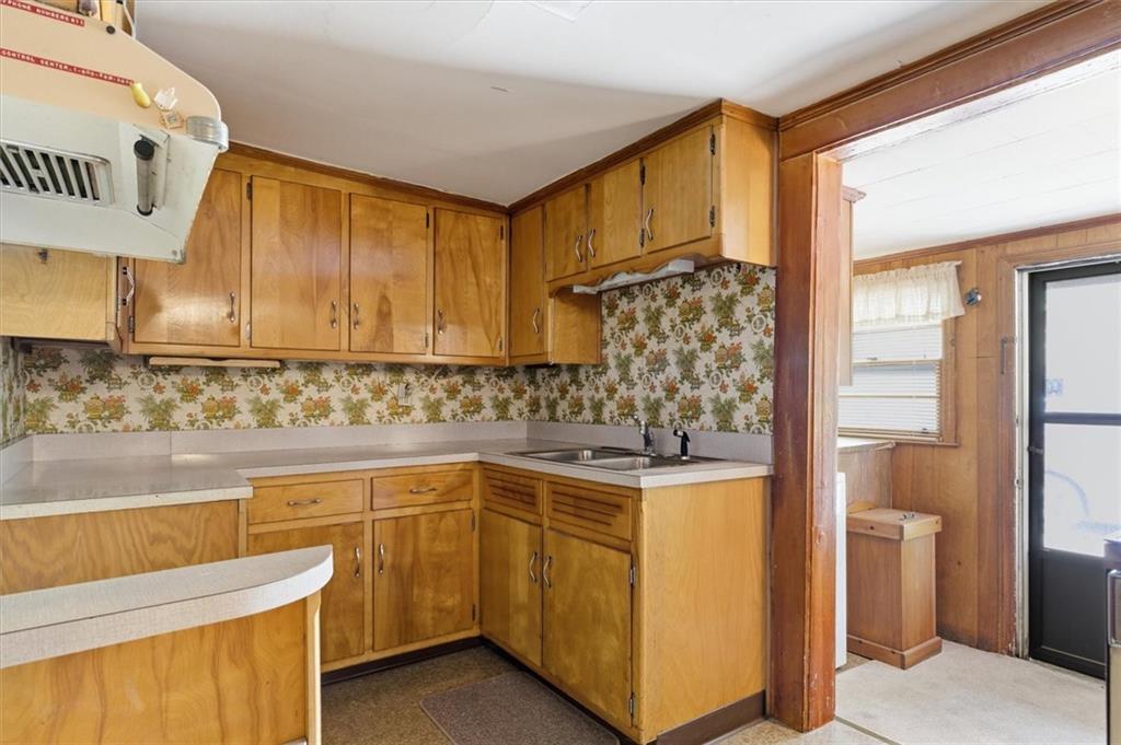870 Marietta Road Canton, GA 30114 - Photo 25 of 43 a kitchen with a sink stove and cabinets
