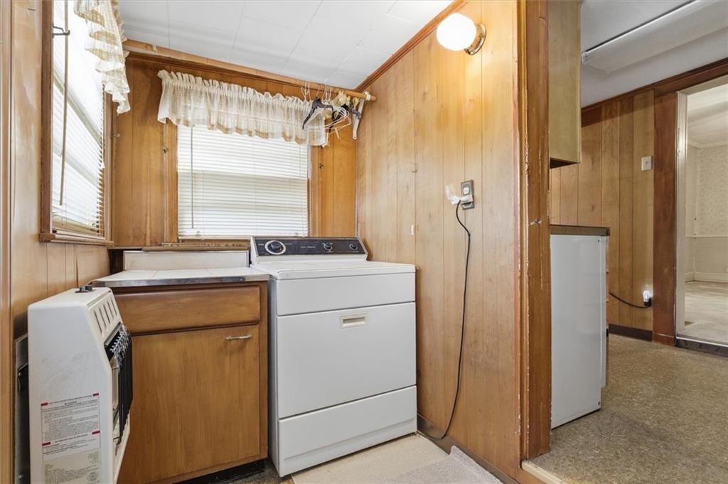 870 Marietta Road Canton, GA 30114 - Photo 29 of 43 a utility room with cabinets washer and dryer