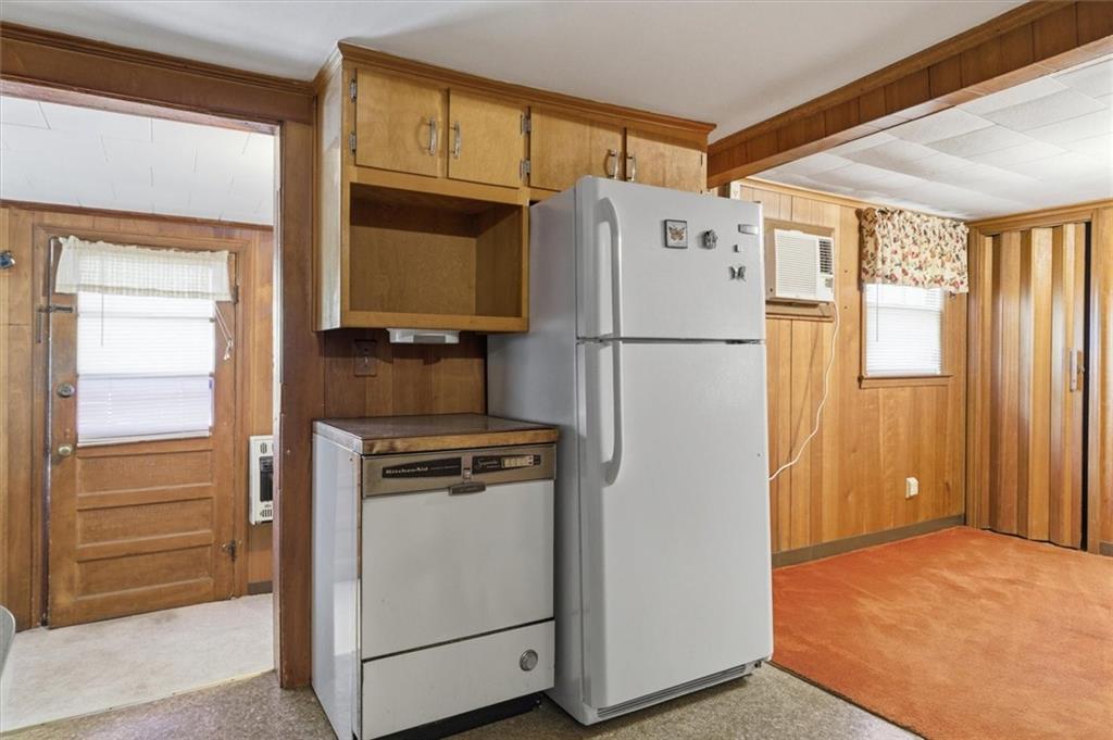 870 Marietta Road Canton, GA 30114 - Photo 31 of 43 a white refrigerator freezer and a stove sitting inside of a kitchen