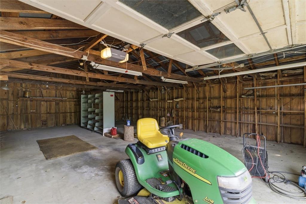 870 Marietta Road Canton, GA 30114 - Photo 36 of 43 a room with lots of furniture and a chandelier
