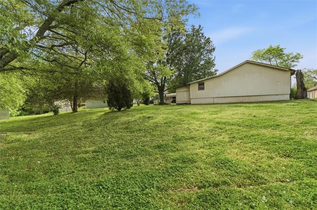 870 Marietta Road Canton, GA 30114 - Photo 39 of 43 a view of a backyard with large trees