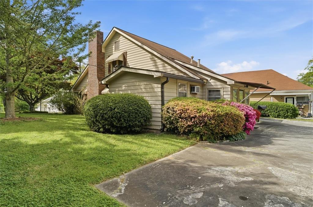 870 Marietta Road Canton, GA 30114 - Photo 41 of 43 a front view of a house with a garden