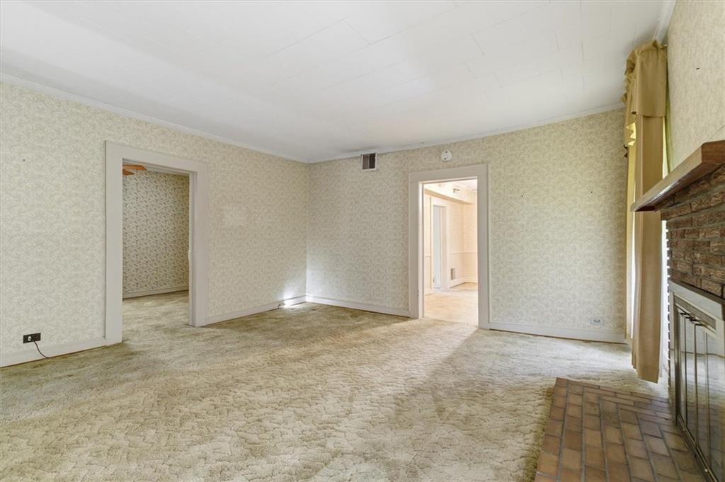 870 Marietta Road Canton, GA 30114 - Photo 8 of 43 a view of an empty room with a fireplace