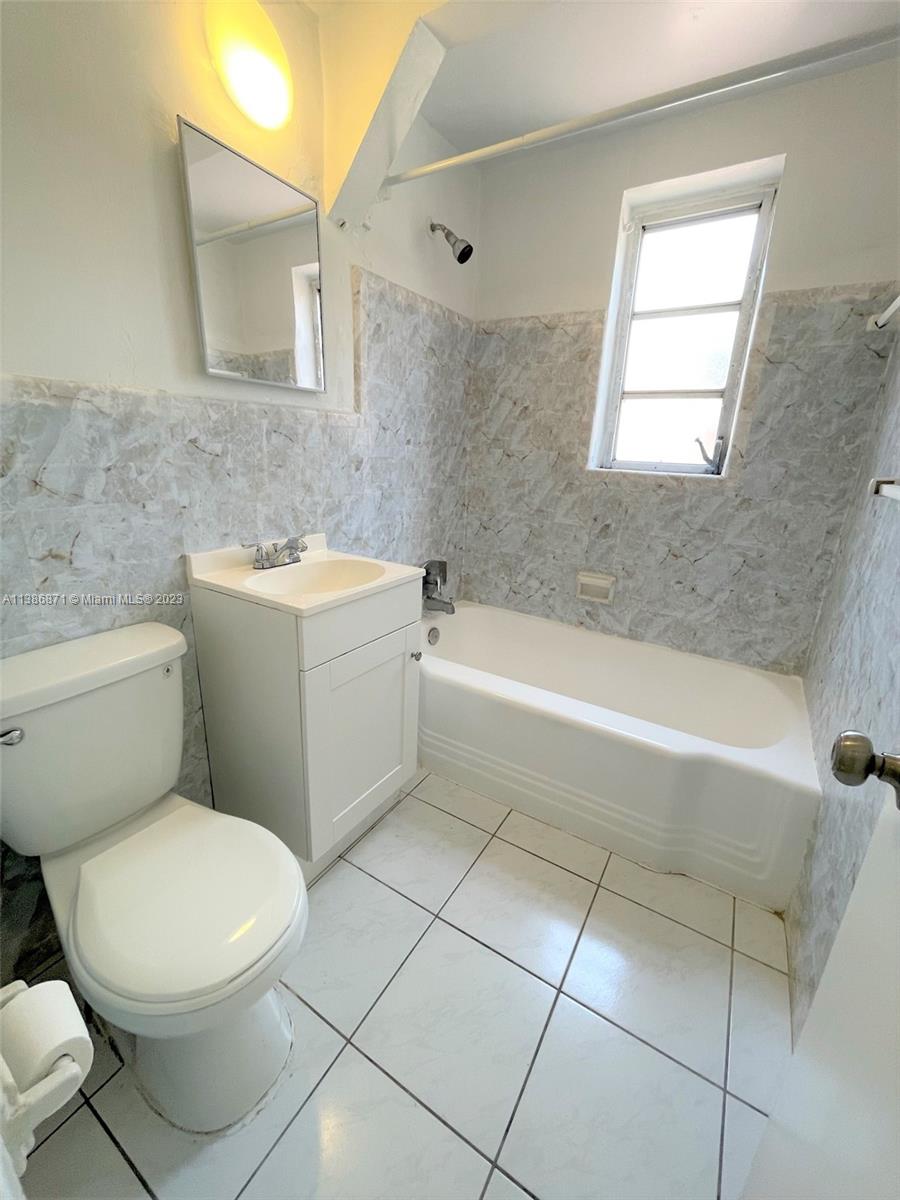 3530 Southwest 10th Street, Unit 2 Miami, FL 33135 - Photo 11 of 13 a bathroom with a toilet a sink and bathtub