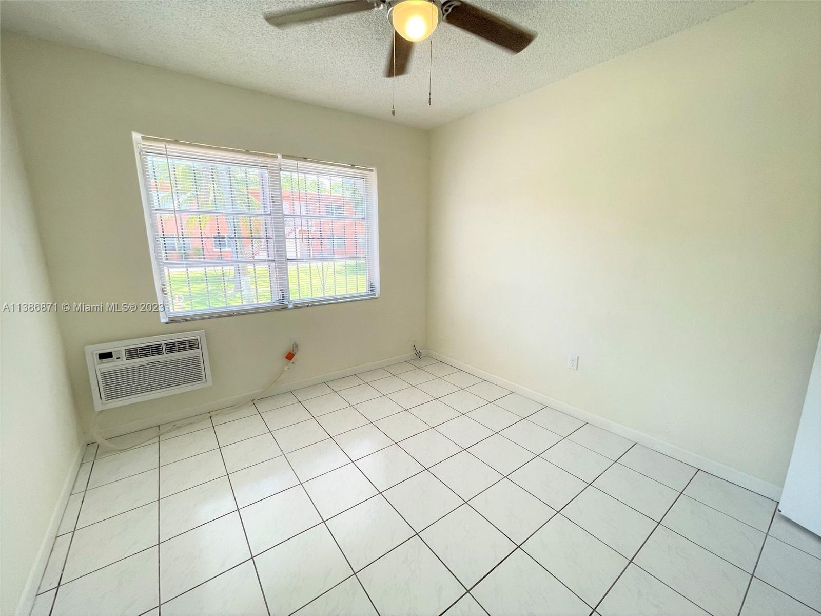 3530 Southwest 10th Street, Unit 2 Miami, FL 33135 - Photo 12 of 13 a view of an empty room and window