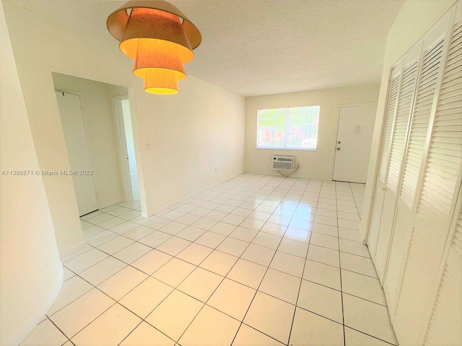 3530 Southwest 10th Street, Unit 2 Miami, FL 33135 - Photo 2 of 13 a view of an empty room and window
