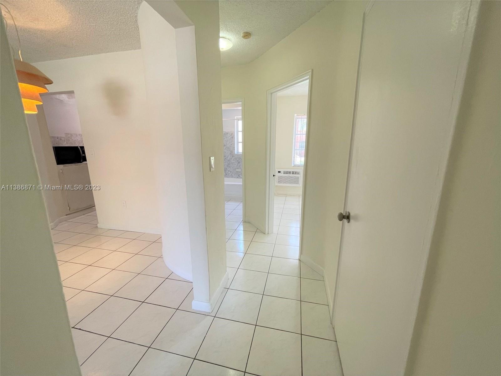 3530 Southwest 10th Street, Unit 2 Miami, FL 33135 - Photo 7 of 13 a bathroom with a sink and a mirror