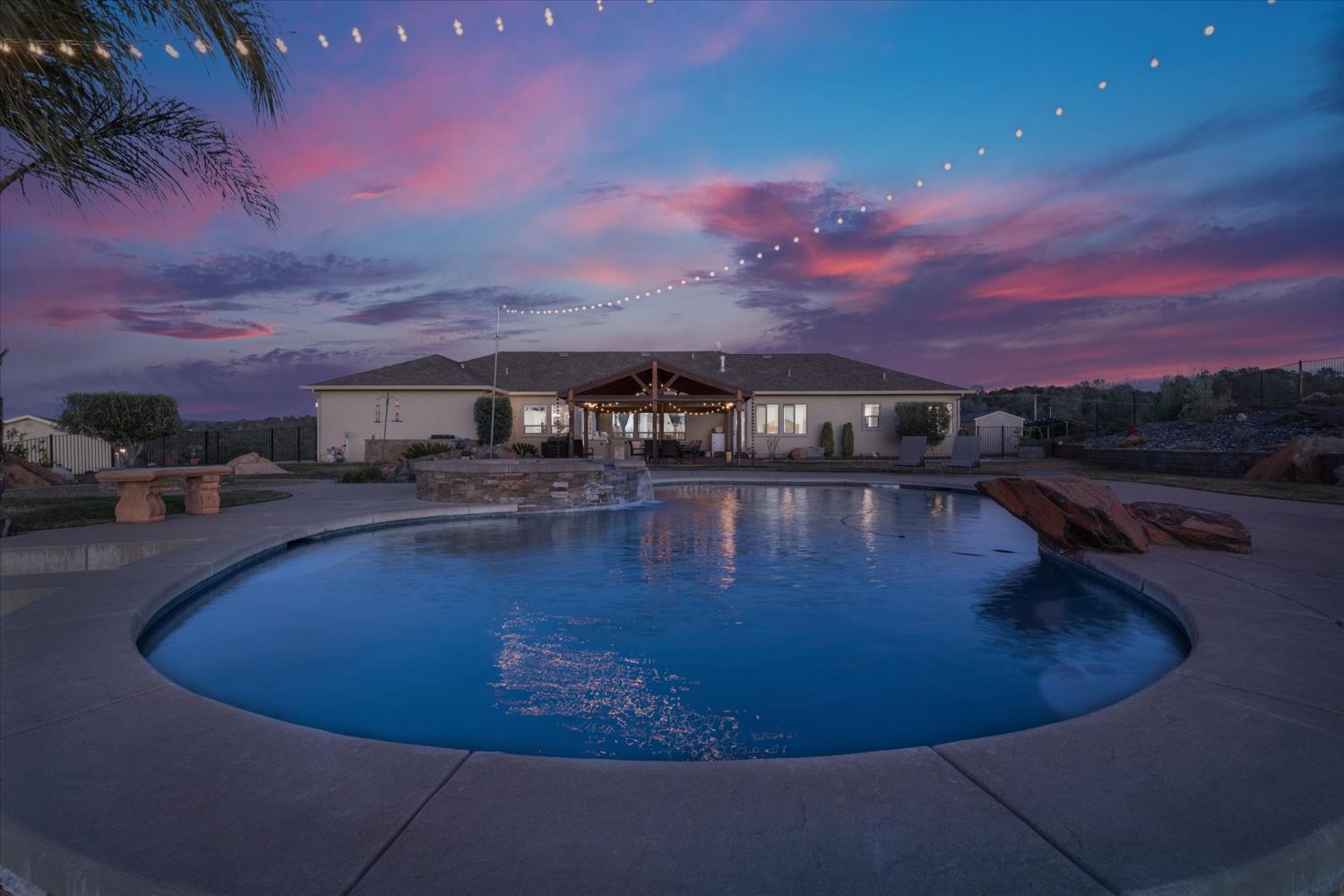 a view of a swimming pool with a yard