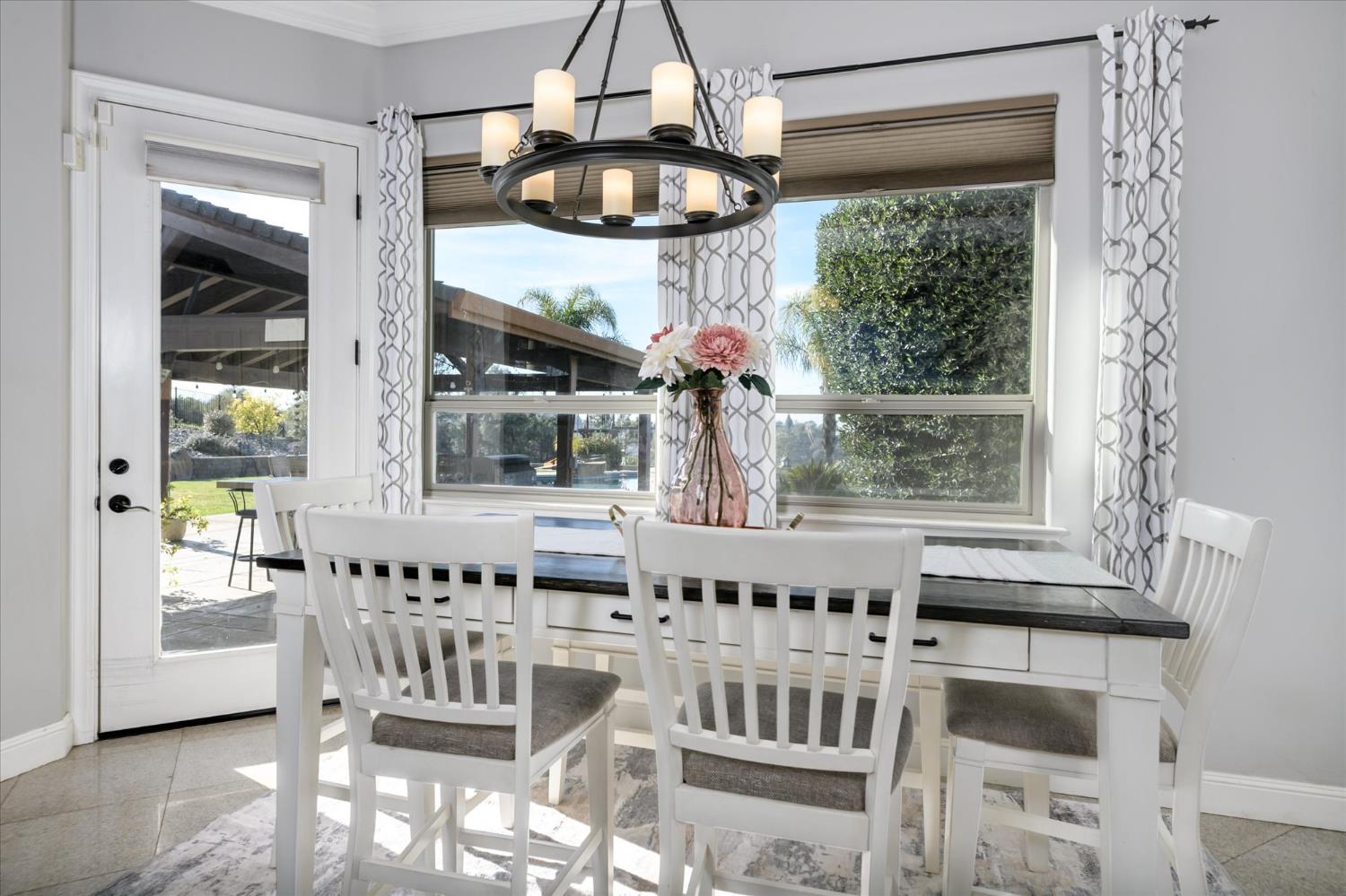 5880 Bumper Road El Dorado, CA 95623 - Photo 11 of 71 a view of a dining room with furniture window and outside view