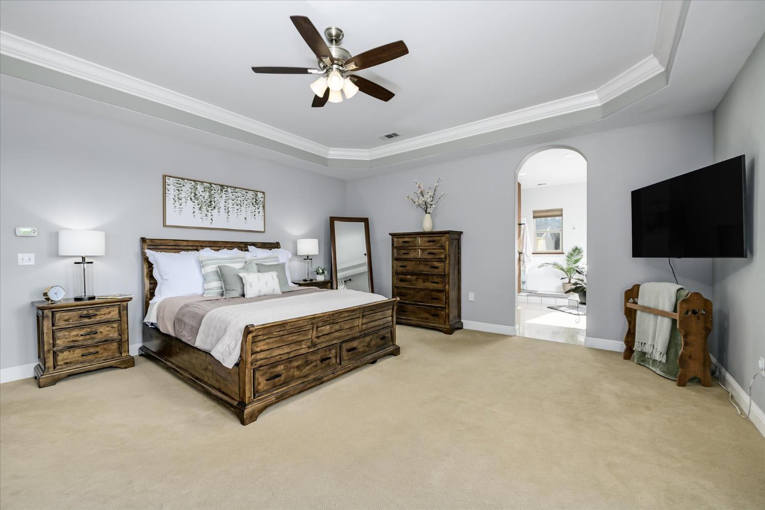 5880 Bumper Road El Dorado, CA 95623 - Photo 24 of 71 a spacious bedroom with a bed and a flat screen tv