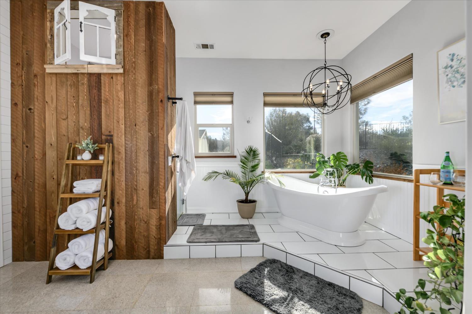 5880 Bumper Road El Dorado, CA 95623 - Photo 25 of 71 a living room with a chandelier and dining table