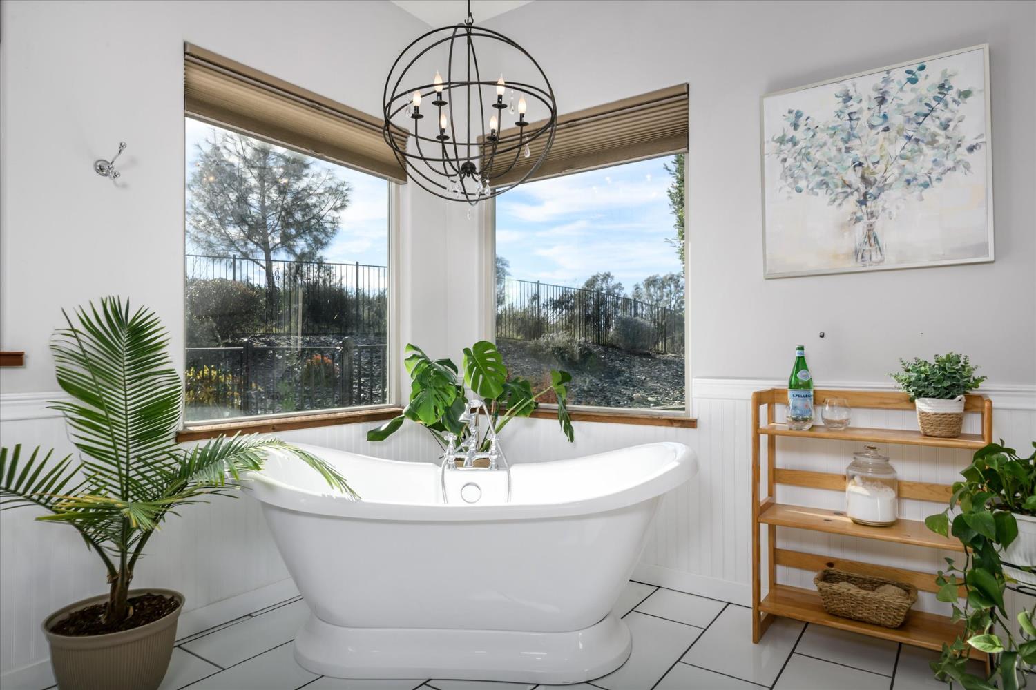 5880 Bumper Road El Dorado, CA 95623 - Photo 26 of 71 a white bath tub sitting in a bathroom next to a window
