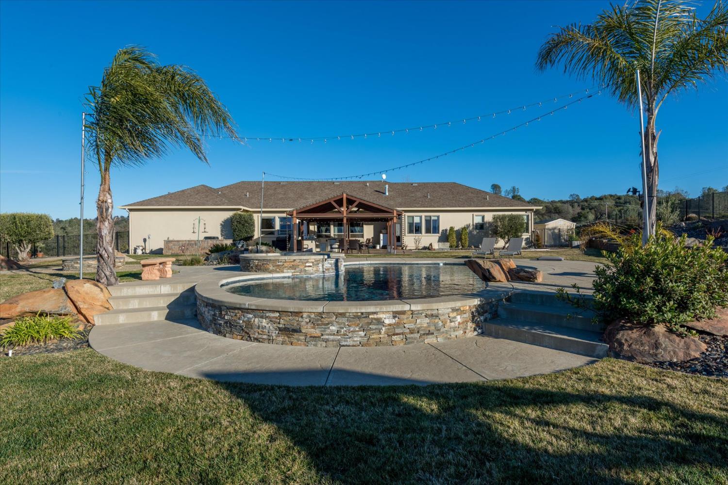 5880 Bumper Road El Dorado, CA 95623 - Photo 35 of 71 a view of a house with swimming pool and a yard