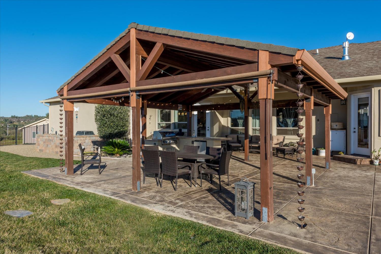 5880 Bumper Road El Dorado, CA 95623 - Photo 36 of 71 a view of a patio with table and chairs and potted plants