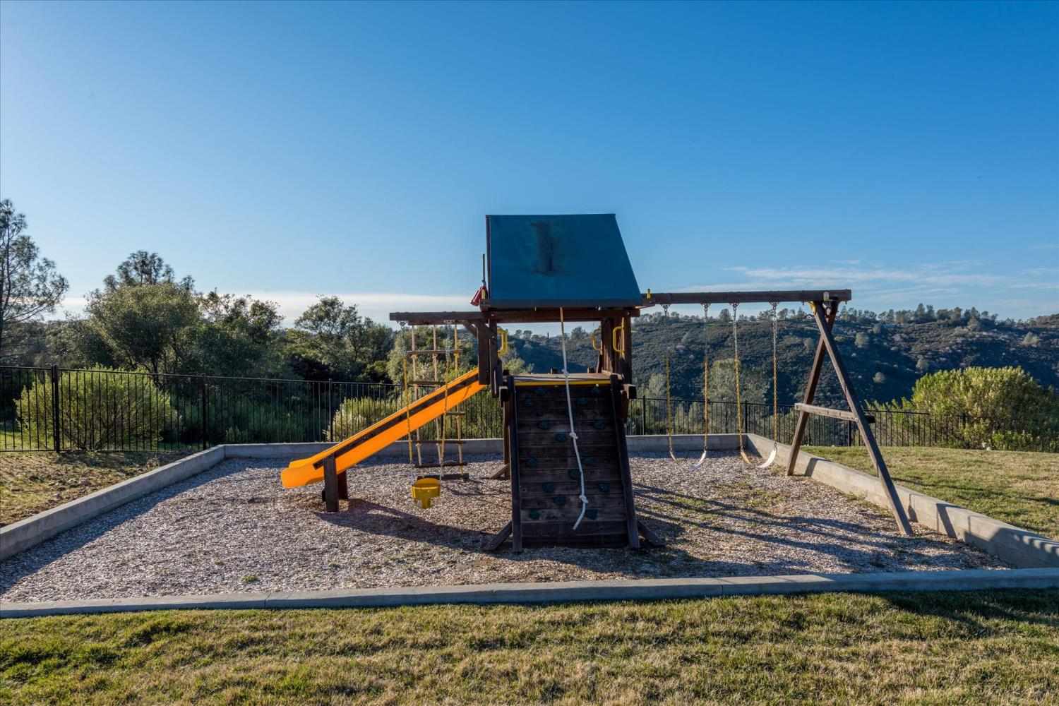 5880 Bumper Road El Dorado, CA 95623 - Photo 44 of 71 a view of a swimming pool with a deck