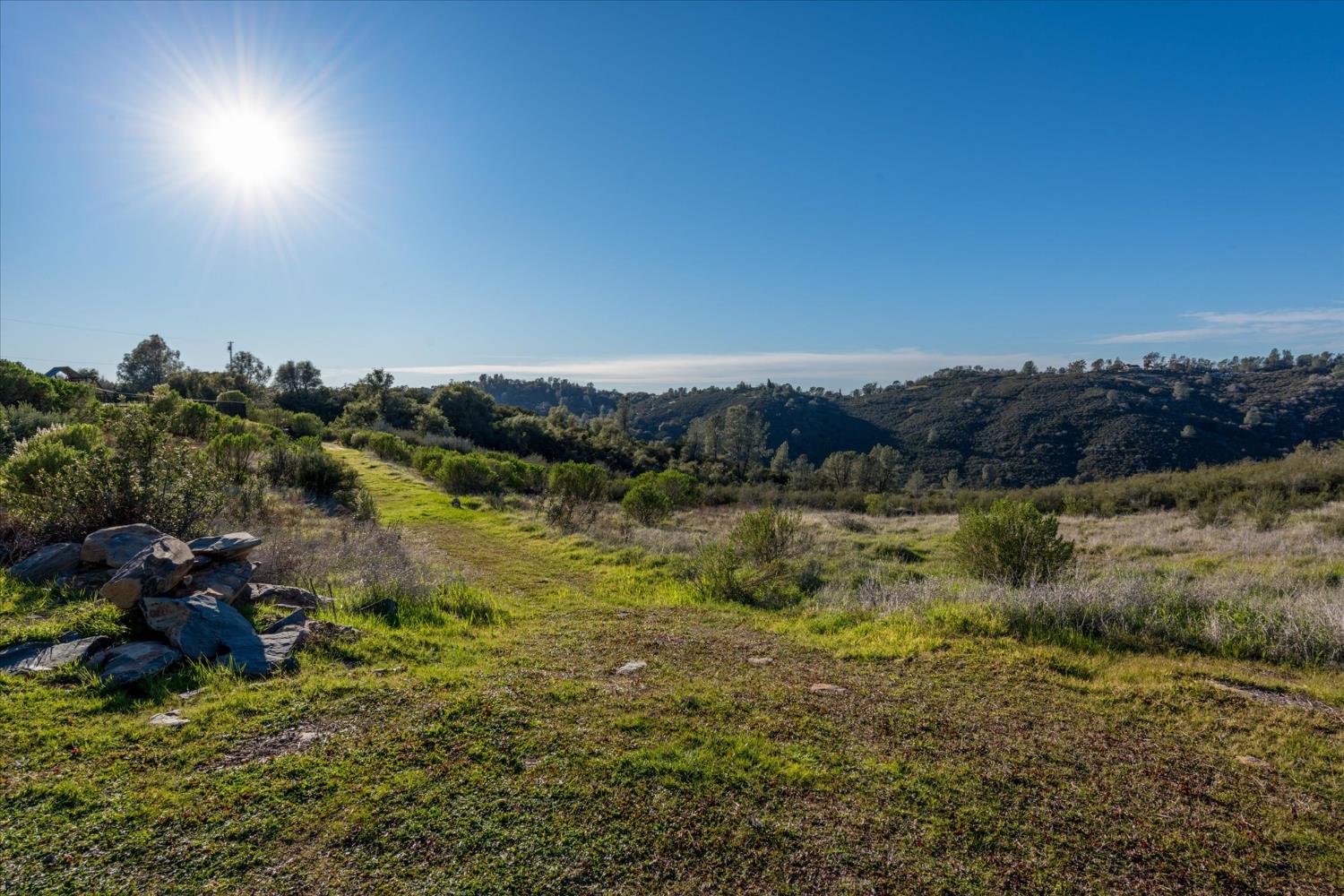 5880 Bumper Road El Dorado, CA 95623 - Photo 47 of 71 a view of a lake with mountains in the background