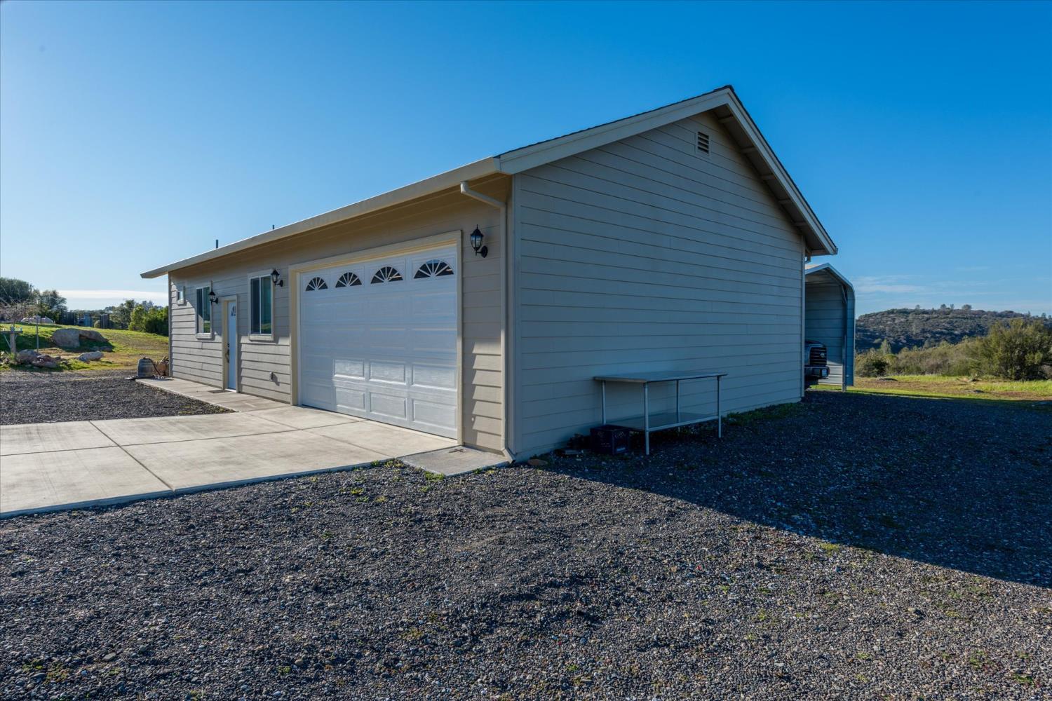 5880 Bumper Road El Dorado, CA 95623 - Photo 49 of 71 a front view of a house with a yard
