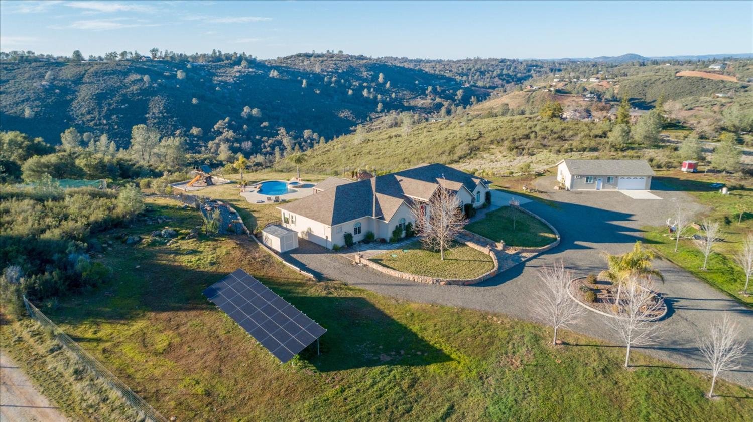 5880 Bumper Road El Dorado, CA 95623 - Photo 63 of 71 an aerial view of a house with yard swimming pool and lake view