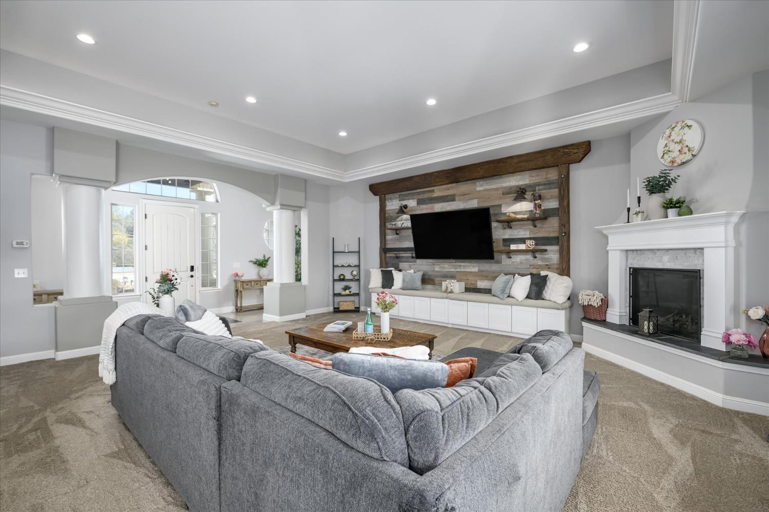 5880 Bumper Road El Dorado, CA 95623 - Photo 9 of 71 a living room with furniture fireplace and a flat screen tv
