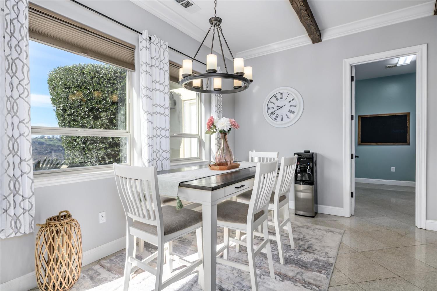 5880 Bumper Road El Dorado, CA 95623 - Photo 10 of 71 a view of a dining room with furniture a chandelier and window