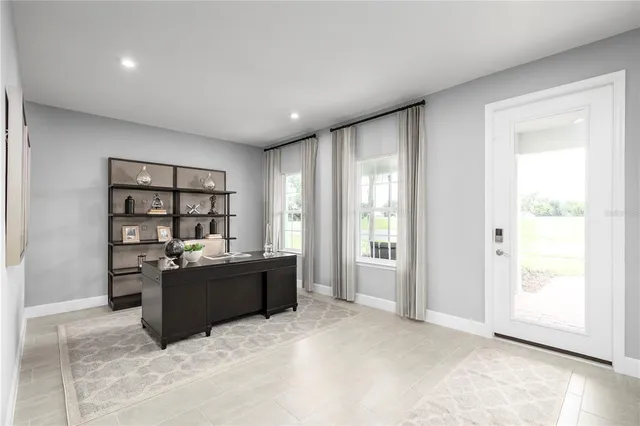 a workspace with furniture and window