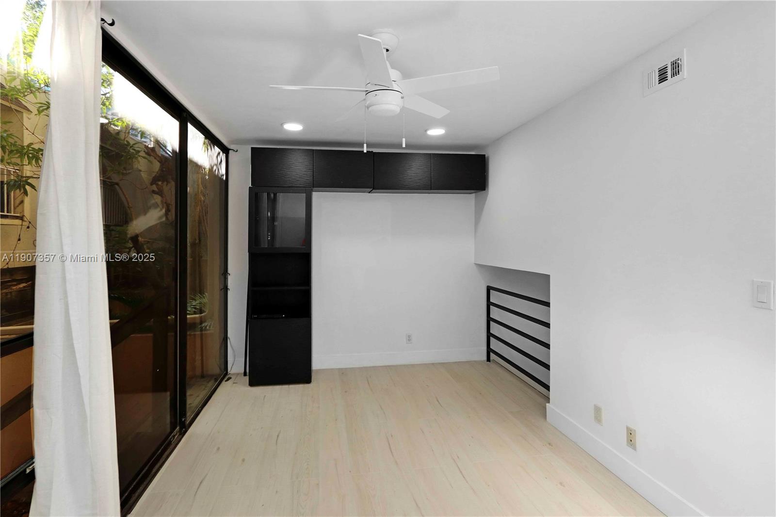 2778 Day Avenue, Unit 2 Miami, FL 33133 - Photo 11 of 21 wooden floor in an empty room with a window