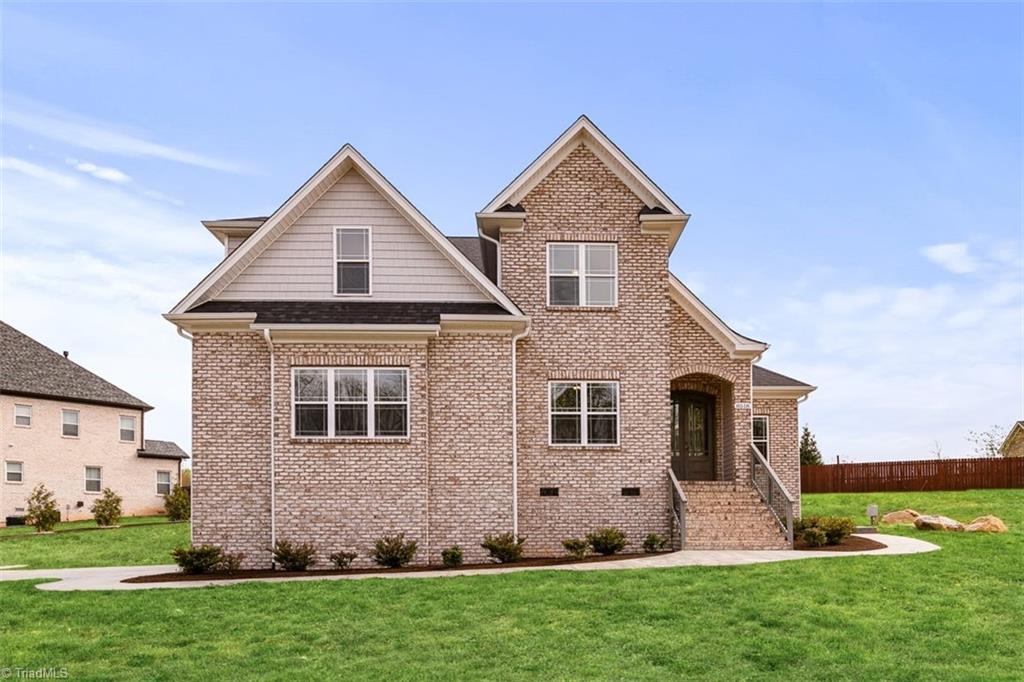 8518 Julina Drive Oak Ridge, NC 27310 - Photo 3 of 41 Grass color enhanced