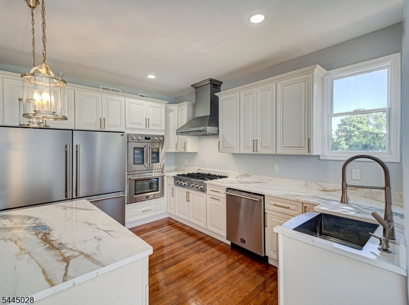 126 Blackwell Road Pennington, NJ 08534 - Photo 10 of 44 a kitchen with a refrigerator sink and cabinets