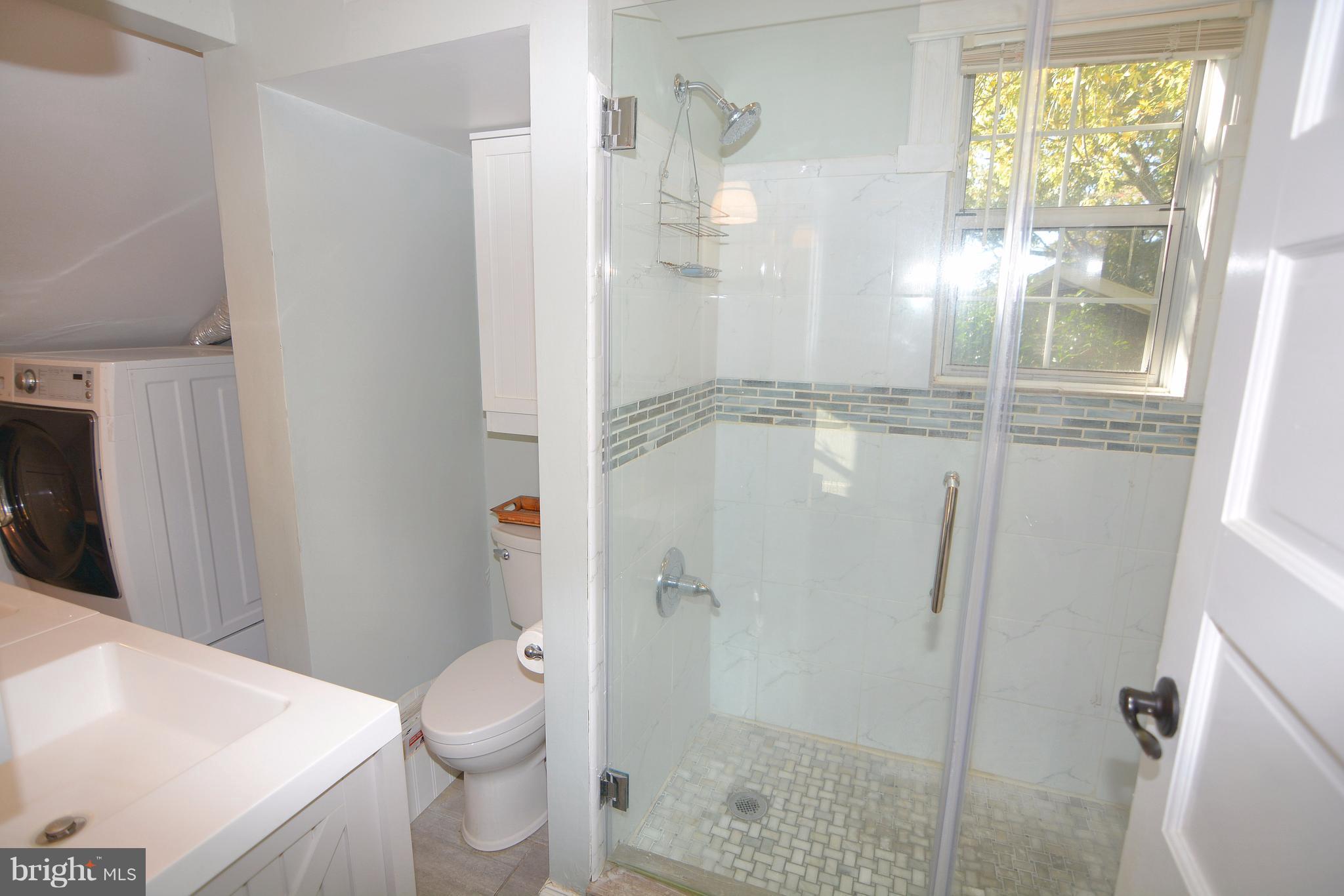 1308 N Road Pasadena, MD 21122 - Photo 23 of 30 Custom tiled shower in master bath