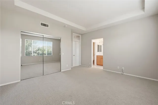a view of an empty room with glass door