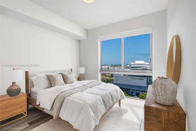 a living room with furniture a rug and a window