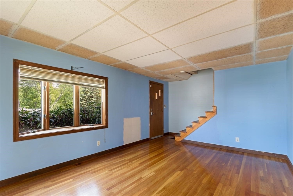 19 Butler Avenue Wakefield, MA 01880 - Photo 6 of 33 a view of empty room with wooden floor and fan