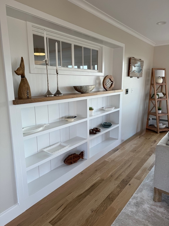 30 Gibson Street Needham, MA 02492 - Photo 11 of 17 a room with wooden floor and cabinets