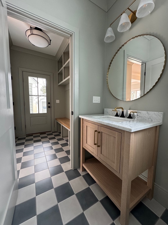 30 Gibson Street Needham, MA 02492 - Photo 13 of 17 a bathroom with a sink a mirror and a shower