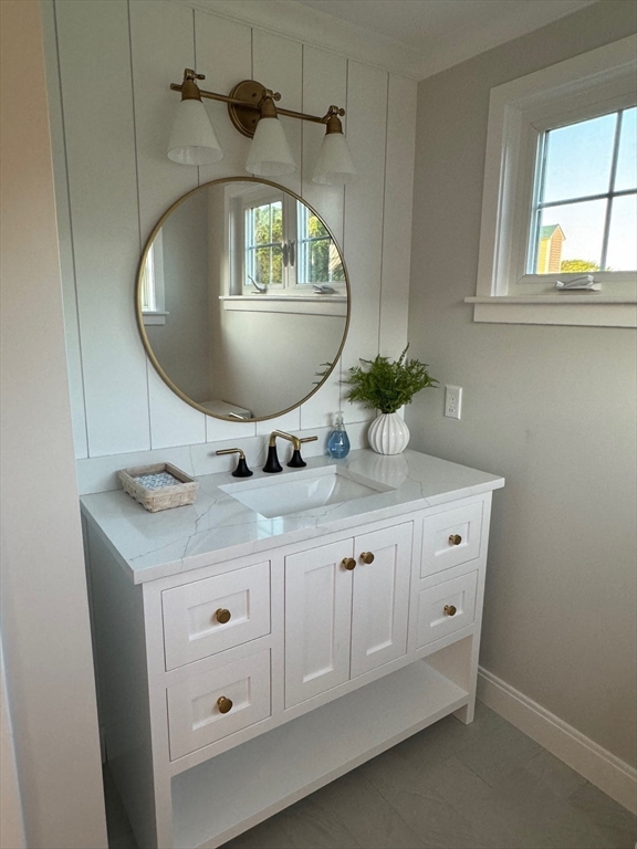 30 Gibson Street Needham, MA 02492 - Photo 15 of 17 a bathroom with a sink and a mirror