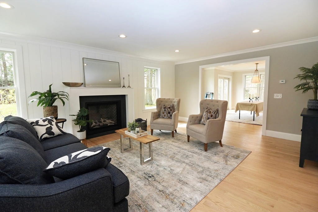 30 Gibson Street Needham, MA 02492 - Photo 8 of 17 a living room with furniture and a fireplace