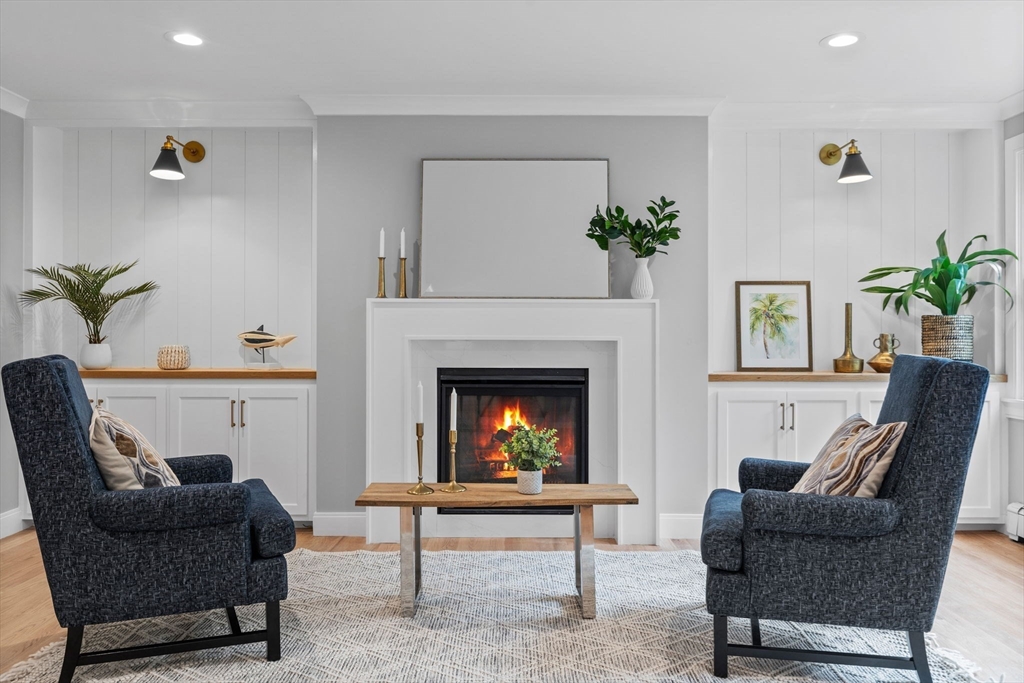30 Gibson Street Needham, MA 02492 - Photo 9 of 17 a living room with furniture and a fireplace